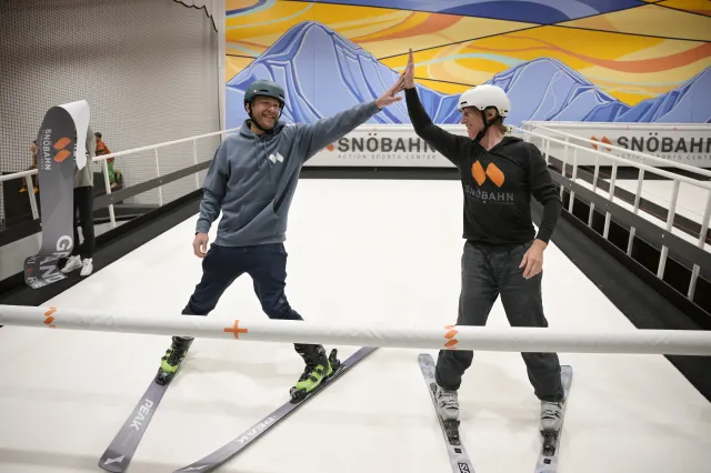 Pro skiers Bode Miller, right, and Chris Anthony ski on the revolving slope during a demonstration at the grand opening ceremony of Snöbahn Thornton Friday, March 8, 2024, in Thornton, Colorado. The company recently inked a deal with Unrivaled Sports to help take the concept nationwide.